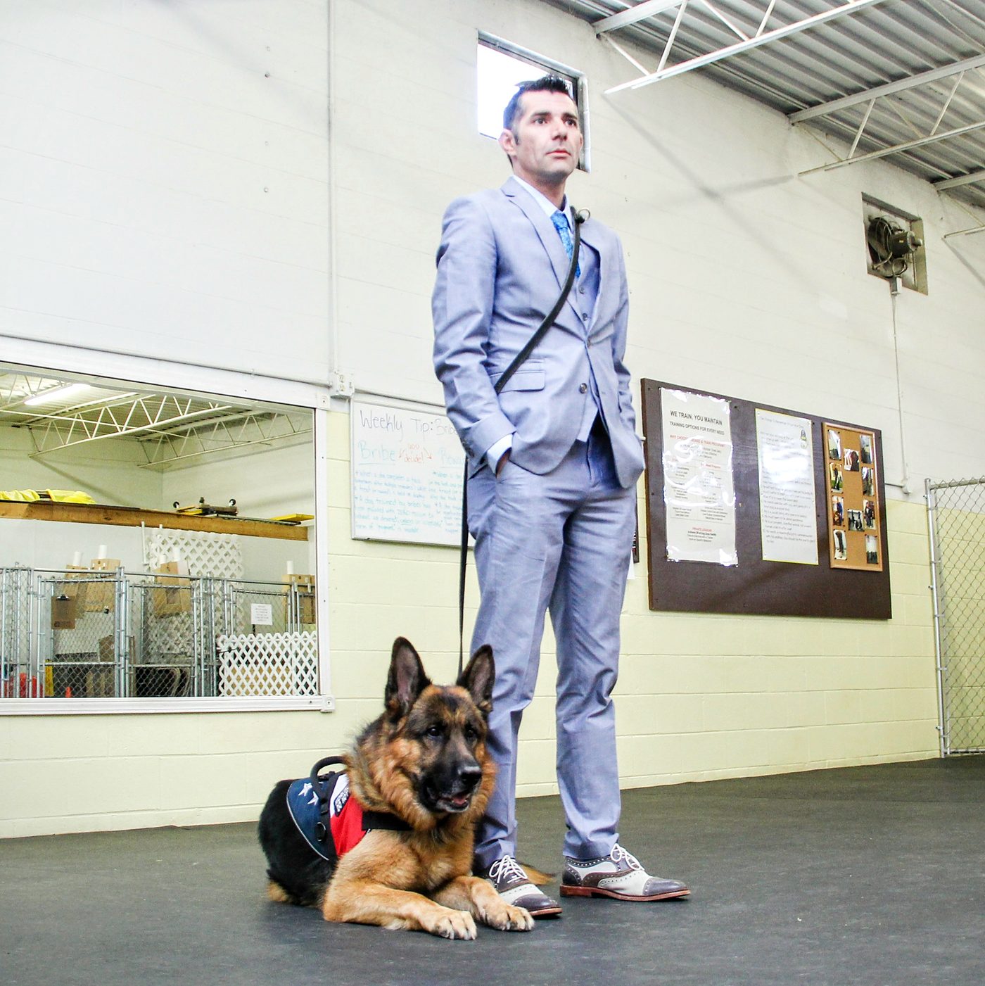 Kenny Bass and Atlas overseeing a service-dog training session at The Battle Buddy Foundation’s former training facility.