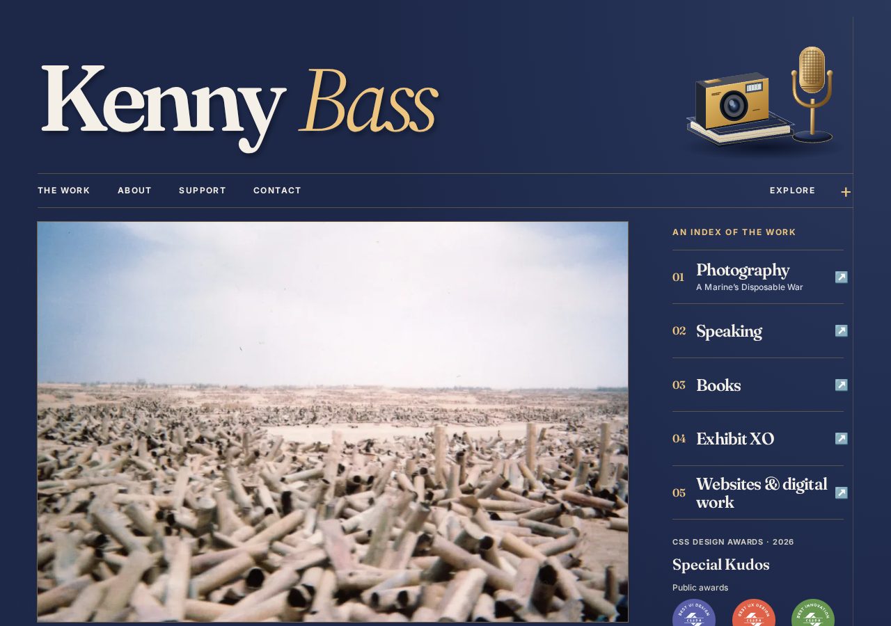 Desktop homepage of KennyBass.com showing the photograph-led layout and editorial navigation.